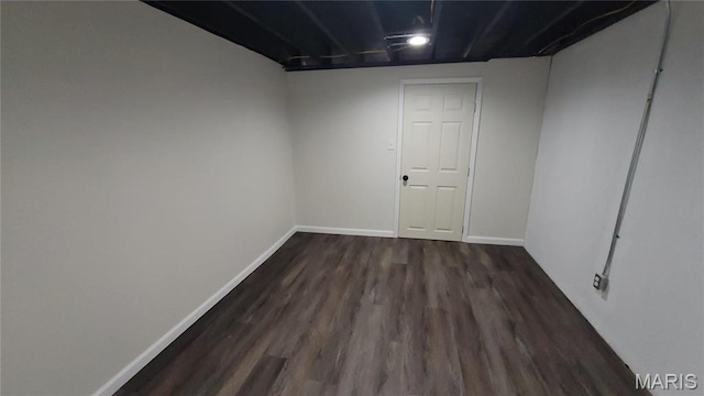 10216 Pannell Dr, Saint Louis, MO 63136 - finished basement featuring dark wood-type flooring and baseboards