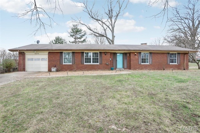 29 Zinnia Dr, Belleville, IL 62221 - ranch-style house featuring an attached garage, concrete driveway, brick siding, and a front yard