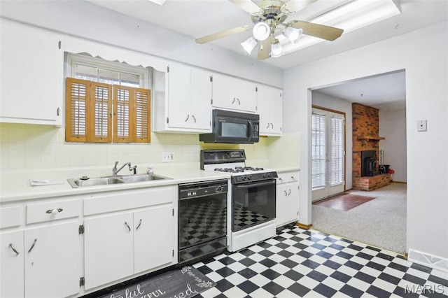 29 Zinnia Dr, Belleville, IL 62221 - kitchen featuring black appliances, tile patterned floors, white cabinetry, light countertops, and a sink