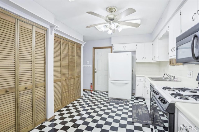 29 Zinnia Dr, Belleville, IL 62221 - kitchen with freestanding refrigerator, black microwave, tile patterned floors, and range with gas cooktop