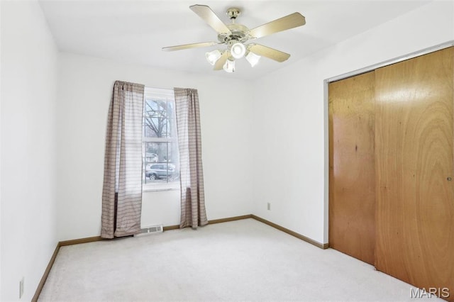 29 Zinnia Dr, Belleville, IL 62221 - unfurnished bedroom with carpet flooring, baseboards, ceiling fan, and a closet