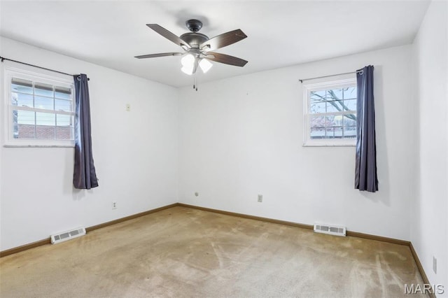 29 Zinnia Dr, Belleville, IL 62221 - spare room with baseboards, carpet flooring, and a ceiling fan
