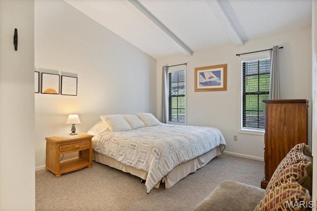 bedroom featuring light carpet and baseboards