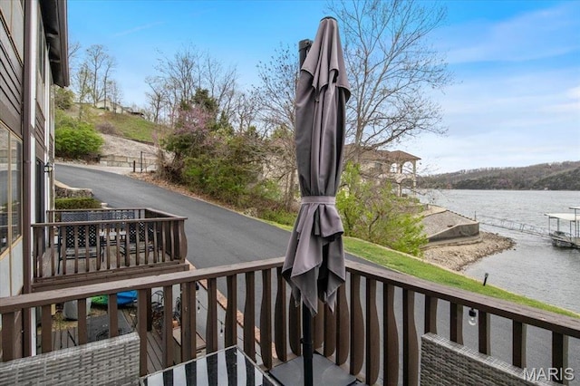 wooden terrace with a water view