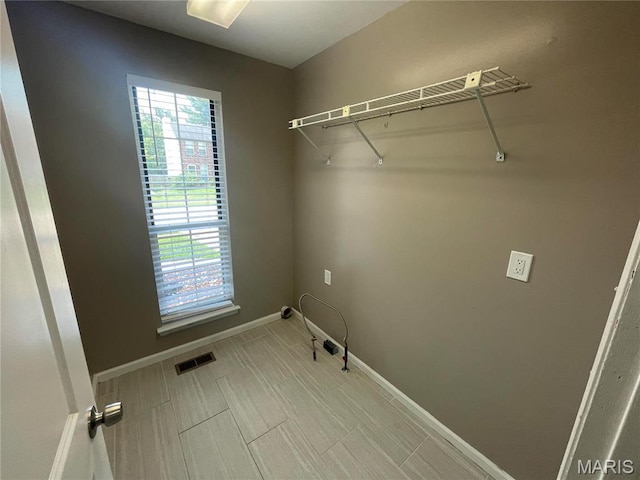3078 Willow Creek Estates Dr, Florissant, MO 63031 - laundry area with plenty of natural light and baseboards
