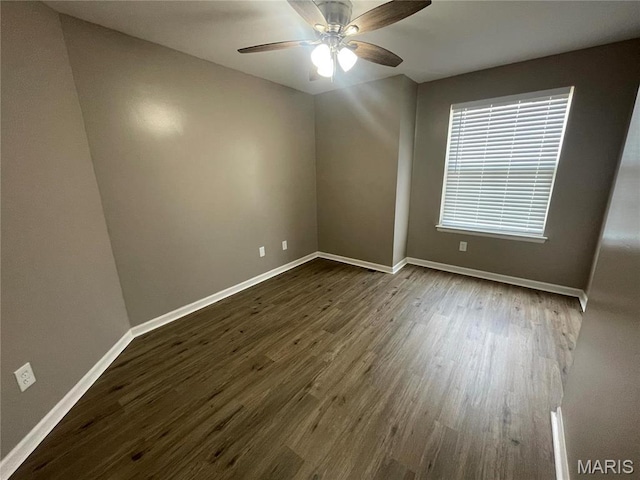 3078 Willow Creek Estates Dr, Florissant, MO 63031 - spare room with dark wood-type flooring, baseboards, and ceiling fan