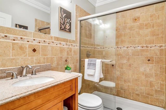 7415 Wellington Ave, Saint Louis, MO 63130 - full bath with crown molding, tile walls, a stall shower, toilet, and vanity
