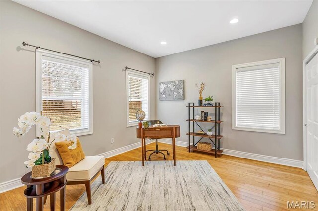 7415 Wellington Ave, Saint Louis, MO 63130 - living area featuring light wood-style floors and recessed lighting