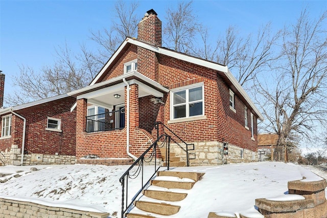 7001 Plymouth Ave, Saint Louis, MO 63130 - view of front of home with a chimney and brick siding