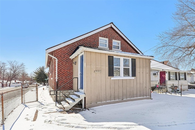 7001 Plymouth Ave, Saint Louis, MO 63130 - view of front of house with entry steps, a fenced backyard, and a gate