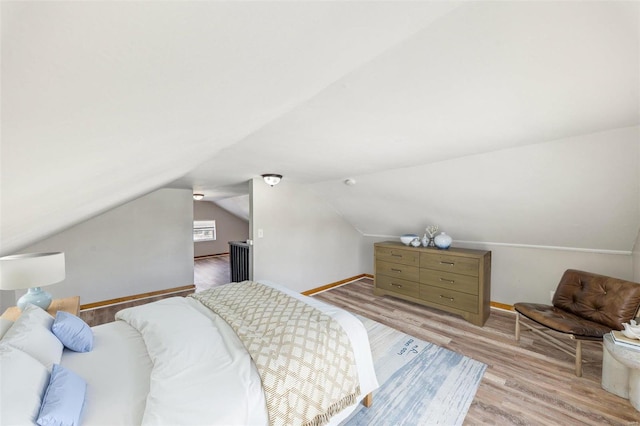 7001 Plymouth Ave, Saint Louis, MO 63130 - bedroom with vaulted ceiling, light wood finished floors, and baseboards