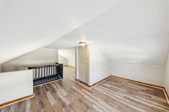 7001 Plymouth Ave, Saint Louis, MO 63130 - bonus room featuring wood finished floors, baseboards, and vaulted ceiling