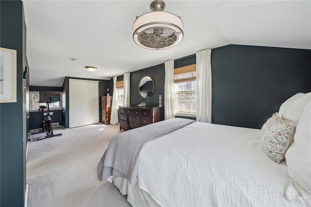 carpeted bedroom with vaulted ceiling