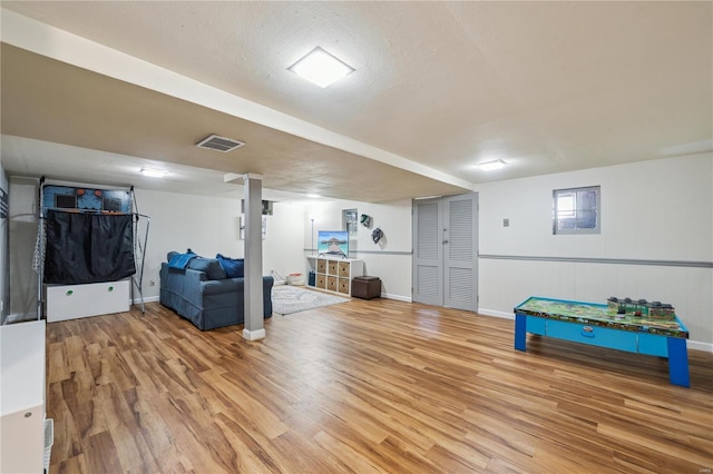 playroom with light wood-type flooring and baseboards