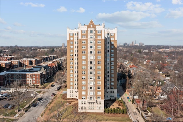 view of apartment building / complex featuring a city view