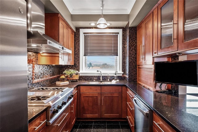 kitchen with wall chimney range hood, appliances with stainless steel finishes, granite floors, a sink, and crown molding