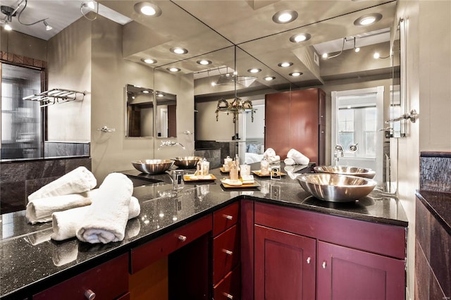 bathroom with recessed lighting, vanity, and tasteful backsplash