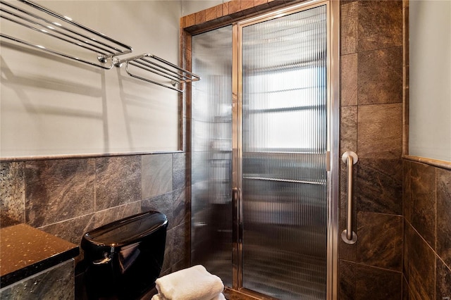full bathroom with a stall shower and toilet