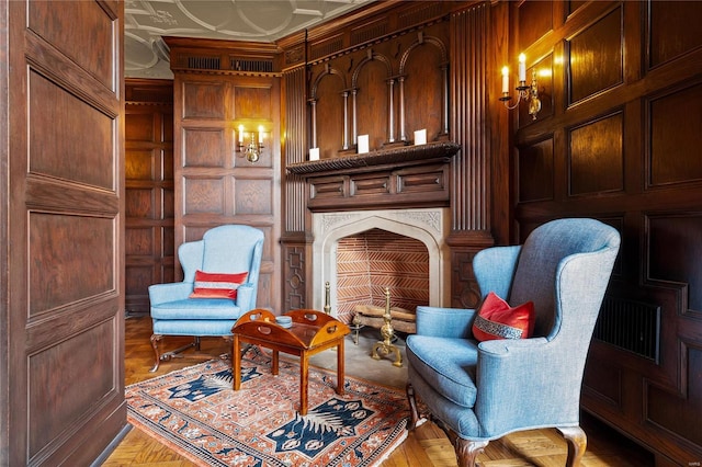 sitting room featuring wood walls