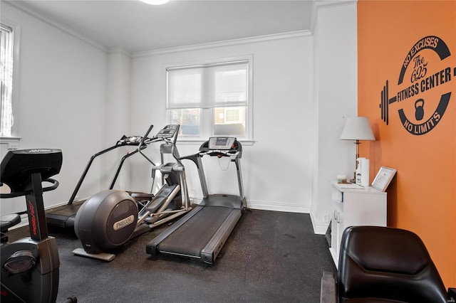 workout room featuring ornamental molding and baseboards