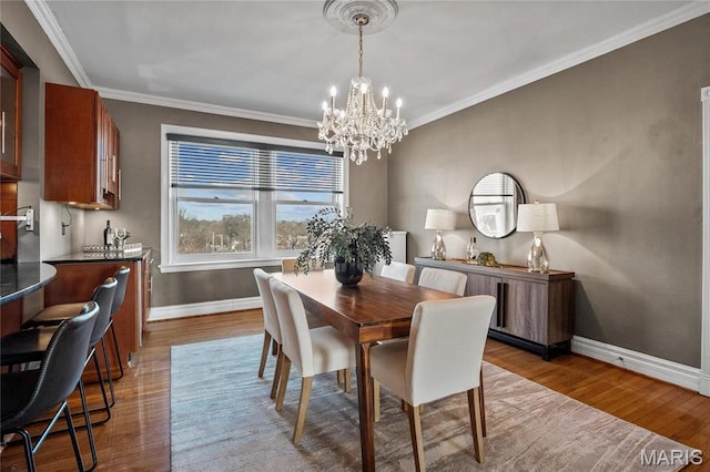 625 S Skinker Blvd Unit 602, Saint Louis, MO 63105 - dining space with a chandelier, wood finished floors, and ornamental molding