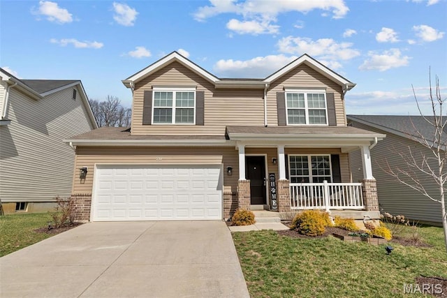 757 Fox Creek Dr, Fenton, MO 63026 - view of front facade featuring a porch, driveway, a garage, and a front yard