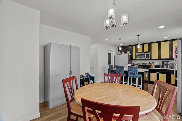 757 Fox Creek Dr, Fenton, MO 63026 - dining room featuring light wood-style floors, baseboards, a chandelier, and recessed lighting
