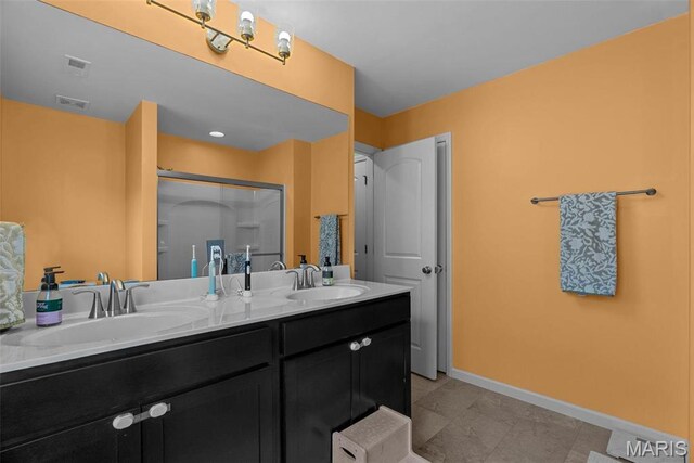 757 Fox Creek Dr, Fenton, MO 63026 - bathroom with double vanity, a shower stall, and tile patterned flooring