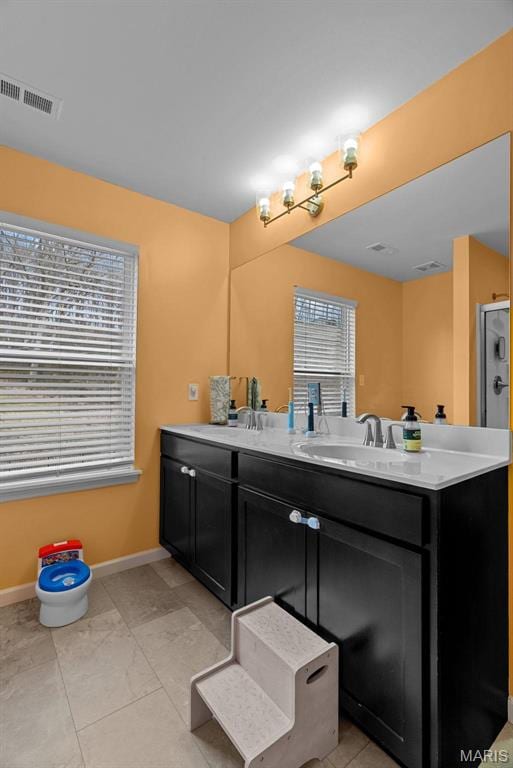 757 Fox Creek Dr, Fenton, MO 63026 - bathroom featuring double vanity and a shower with door
