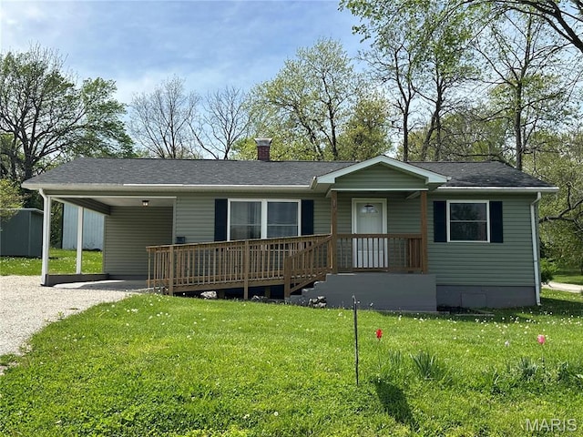 501 N Warfel St, Salem, MO 65560 - view of front of house featuring a front yard, driveway, a chimney, an attached carport, and roof with shingles