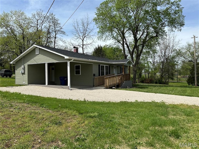 501 N Warfel St, Salem, MO 65560 - ranch-style house featuring a front lawn, a wooden deck, a carport, and a chimney