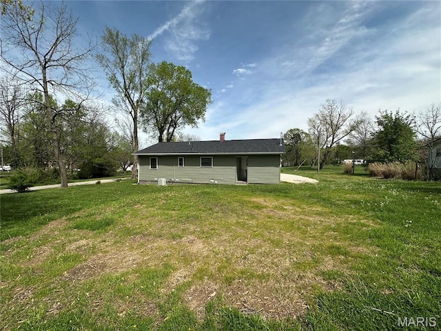 501 N Warfel St, Salem, MO 65560 - back of house with a yard and a chimney