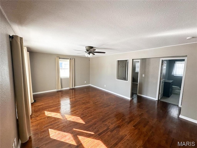 501 N Warfel St, Salem, MO 65560 - spare room featuring a textured ceiling, wood finished floors, a ceiling fan, baseboards, and a smoke detector