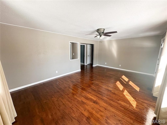 501 N Warfel St, Salem, MO 65560 - empty room with wood finished floors, baseboards, ceiling fan, and a textured ceiling