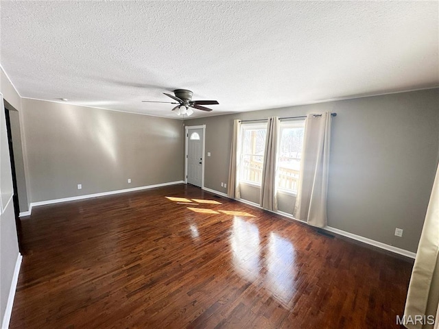501 N Warfel St, Salem, MO 65560 - spare room featuring wood finished floors, ceiling fan, a textured ceiling, and baseboards