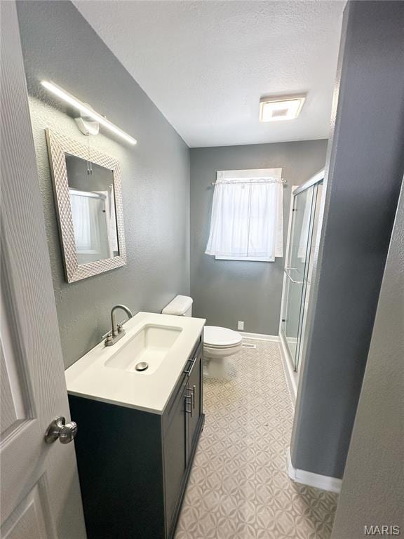 501 N Warfel St, Salem, MO 65560 - full bath featuring a stall shower, toilet, vanity, and baseboards