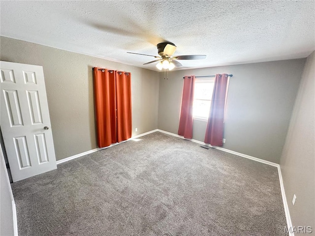 501 N Warfel St, Salem, MO 65560 - unfurnished room featuring a ceiling fan, carpet flooring, baseboards, and a textured ceiling