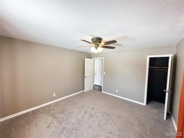 501 N Warfel St, Salem, MO 65560 - unfurnished bedroom featuring carpet, a closet, baseboards, a ceiling fan, and a textured ceiling