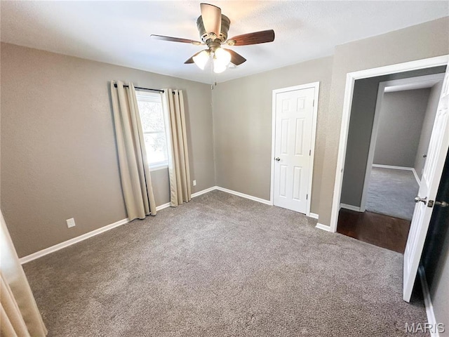 501 N Warfel St, Salem, MO 65560 - unfurnished bedroom featuring carpet flooring, baseboards, and a ceiling fan