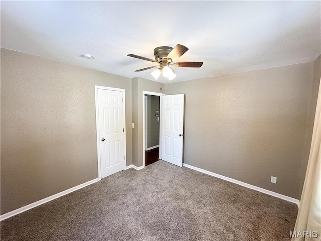 501 N Warfel St, Salem, MO 65560 - unfurnished bedroom with carpet floors, baseboards, and a ceiling fan