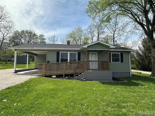 501 N Warfel St, Salem, MO 65560 - view of front facade with gravel driveway, a carport, a front yard, and a chimney