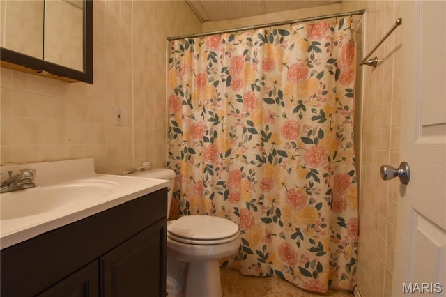 102 W High St, Troy, IL 62294 - bathroom with tile walls, toilet, vanity, a shower with curtain, and tile patterned floors