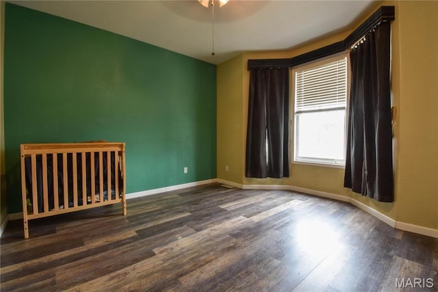 102 W High St, Troy, IL 62294 - spare room featuring wood finished floors, baseboards, and ceiling fan