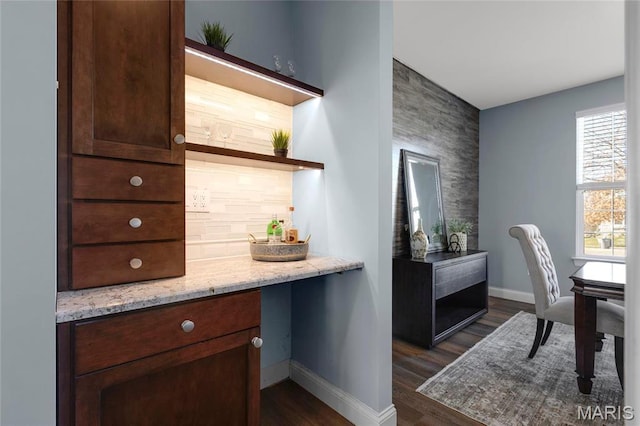 206 Willow Park Ct, Wentzville, MO 63385 - bar with baseboards, dark wood-style floors, and an accent wall