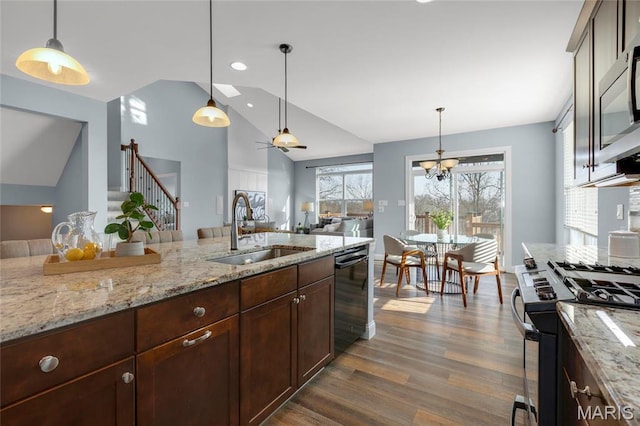 206 Willow Park Ct, Wentzville, MO 63385 - kitchen with a sink, appliances with stainless steel finishes, vaulted ceiling, dark wood-type flooring, and pendant lighting