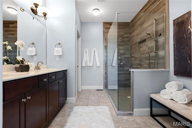 206 Willow Park Ct, Wentzville, MO 63385 - bathroom with a shower stall, double vanity, baseboards, and tile patterned flooring