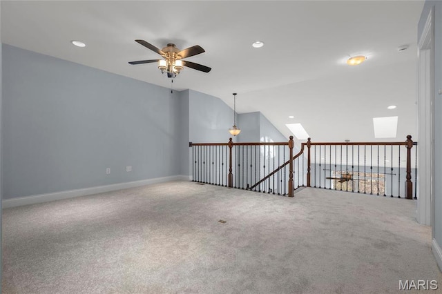 206 Willow Park Ct, Wentzville, MO 63385 - carpeted spare room with a ceiling fan, baseboards, lofted ceiling, recessed lighting, and a skylight