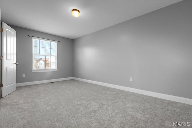 206 Willow Park Ct, Wentzville, MO 63385 - carpeted empty room with baseboards