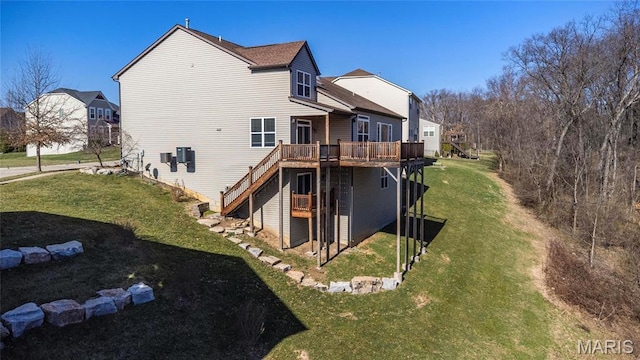 206 Willow Park Ct, Wentzville, MO 63385 - rear view of property featuring a wooden deck, stairway, and a yard