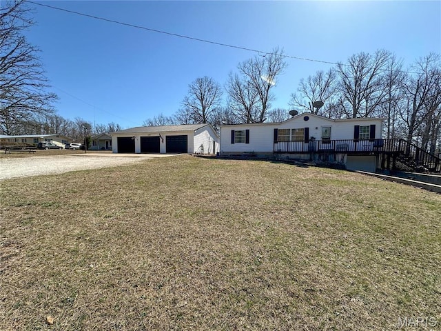405 County Road 5015, Salem, MO 65560 - view of front of house with a front yard, driveway, a garage, and an outdoor structure